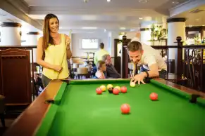 Merton Hotel - Couple playing pool